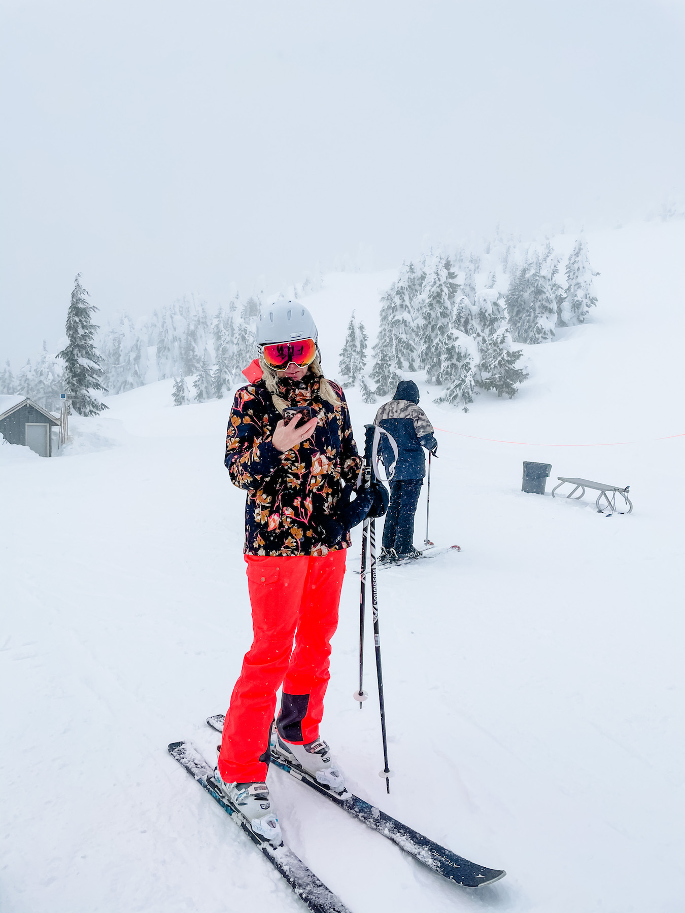 women on on phone at ski hill